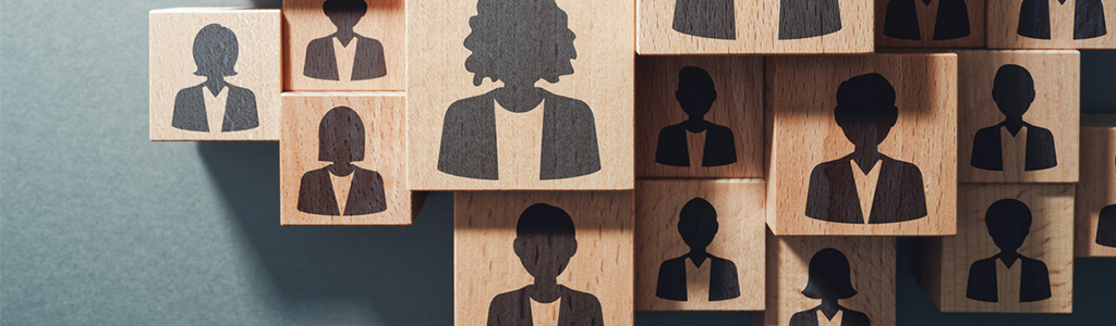 a group of wooden blocks with silhouettes of people on them