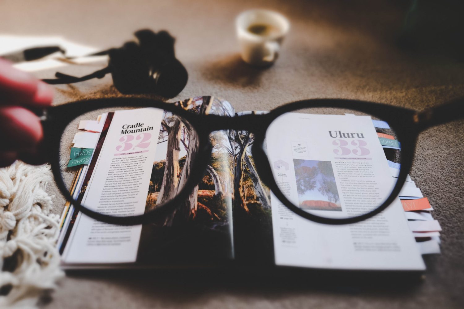 a pair of glasses looking at a magazine with the number 32 on it