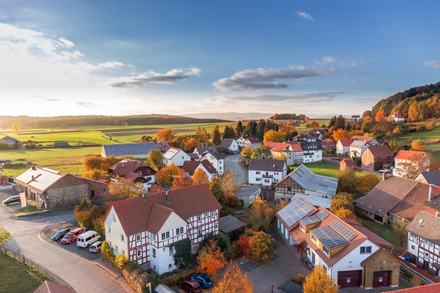 an aerial view of a small town in autumn