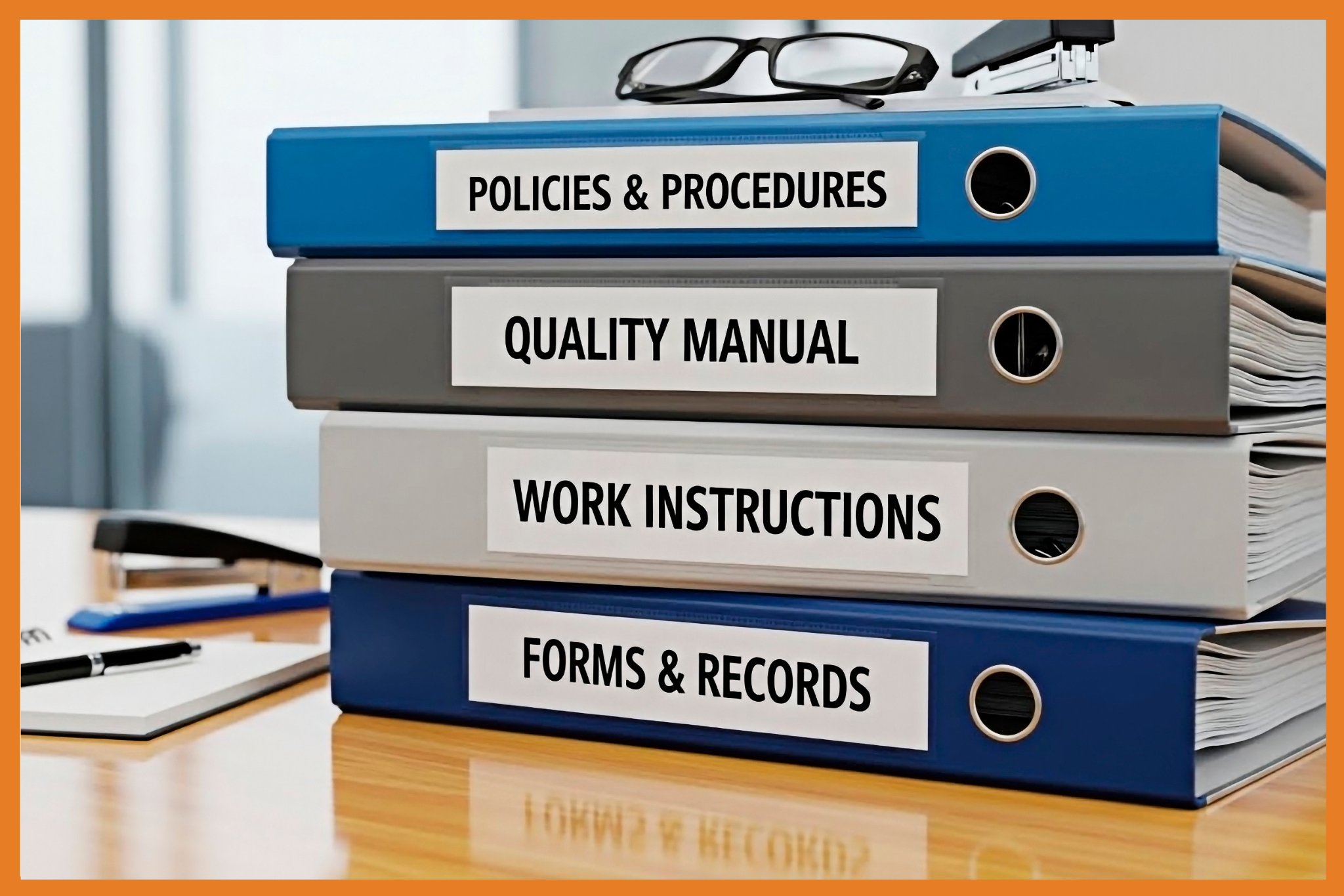 Four labeled binders stacked on a desk: Standing Rules, Policies & Procedures, Quality Manual, and Forms & Records, with glasses and papers in the background.
